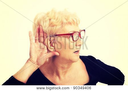 Senior woman overhears a conversation