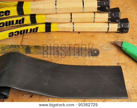 Stripped Tennis racquet handles with heat shrink tube and tools for upsizing