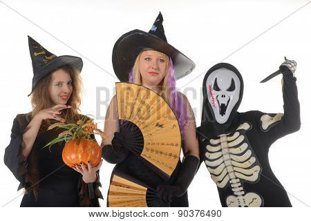 Three women witches posing in scary outfits
