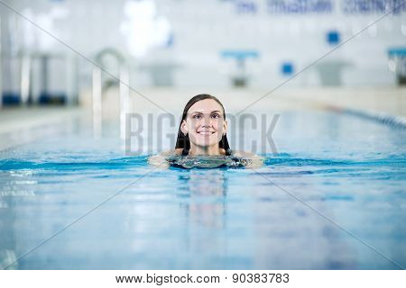 Portrait of a young woman in sport swimming pool