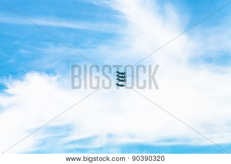 Four Military Fighter Aircrafts In White Clouds