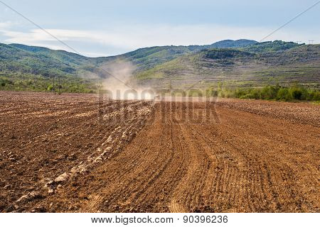 Plowing Tractor On Agricultural Field