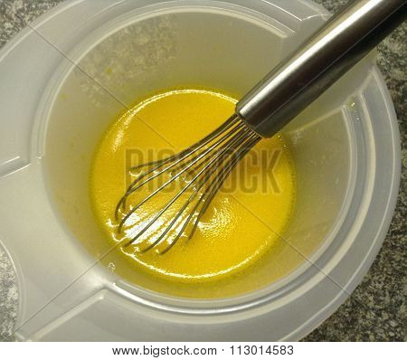 High angle view of fresh oil dressing with lemon juice for salad in a bowl