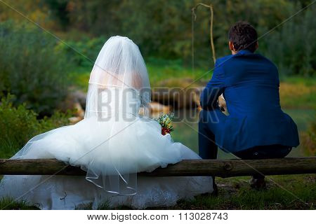 bride and groom fishing together - romantic wedding concept.