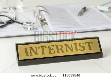 Name Plate On A Desk With The Engraving Internist