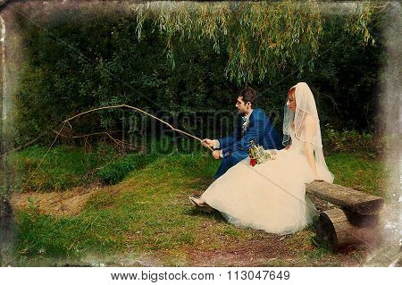 bride and groom fishing together - romantic wedding concept. Retro variant.