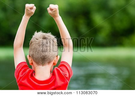 Child Celebrating Success Or Victory