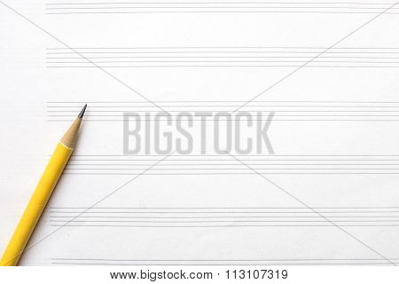 Music Sheet And Yellow Pencil