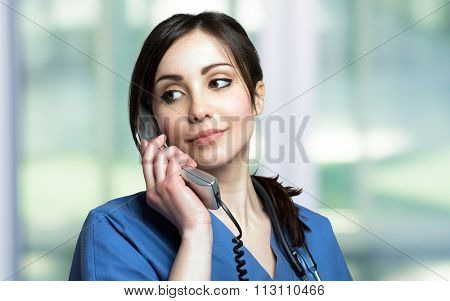 Portrait of a female nurse talking on the phone
