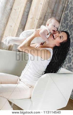 Portrait of happy mother and child in the home environment