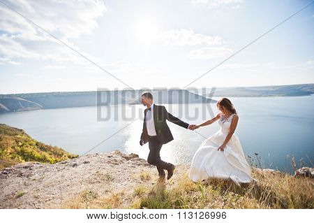 Very Sensual And Gorgeus Wedding Couple On The Picturesque Landscapes