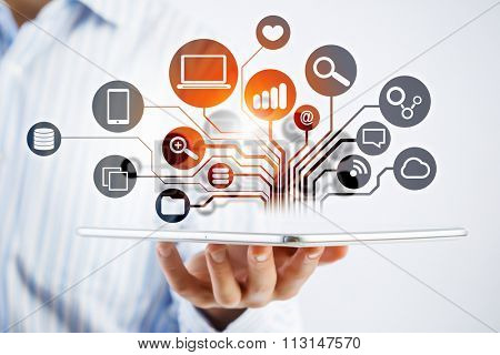 Hands of businessman demostrating tablet and network connection  concept