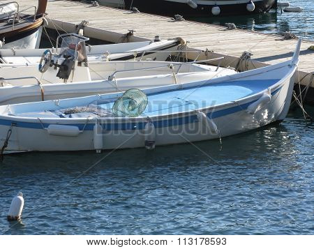 Little Fishing Boats Anchored In A Village Port Of Golfo Dei Poeti, Province Of La Spezia, Italy