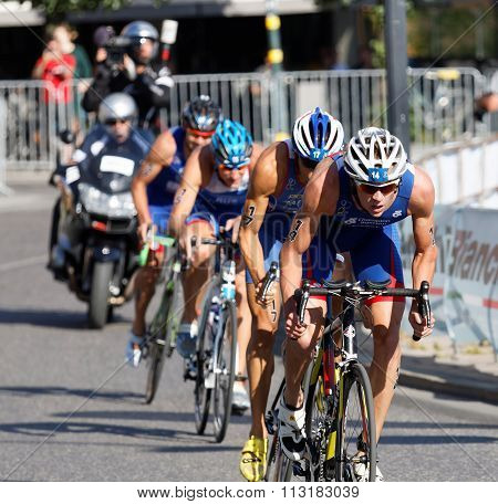 Group Of Four Cycling Triathlon Competitors