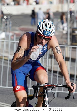 Cycling Triathlon Athlete Dimitry Polyanskiy Drinking