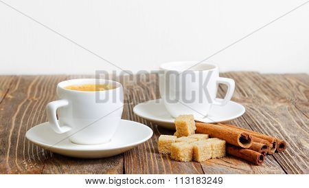 Two Cup Of Hot Esspresso, Cinnamon And Sugar Cane