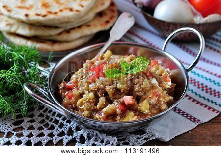 Baba ganush (salad) with tomato, white onion, olive oil and sea salt with lavash bread