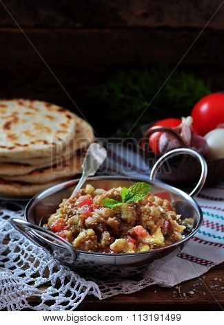 Baba ganush (salad) with tomato, white onion, olive oil and sea salt with lavash bread