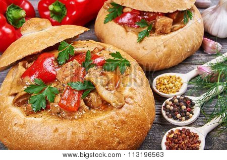 Stew Made From Meat, Vegetables And Mushrooms In A Bread Bowl
