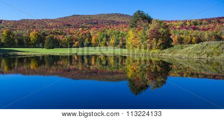 Stunning fall foliage and lake in Vermont, USA