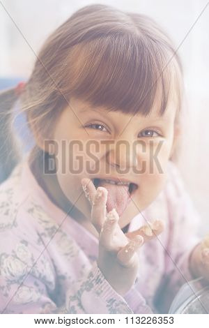 girl eating pastry