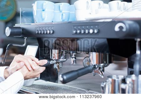 Man Hands Putting Holder In Coffee Machine