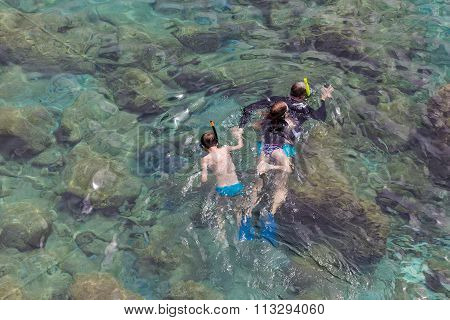 Top View Of People Swimming At Milos, In Greece