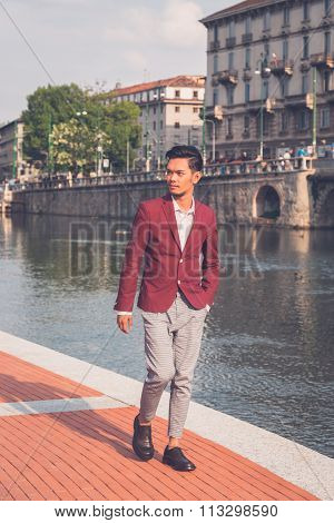 Handsome Asian Model Posing By An Artificial Basin