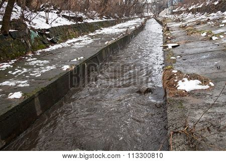 Urban Stream In Winter. The Lybid River.