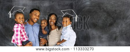 Happy young couple who are standing with their son at graduation