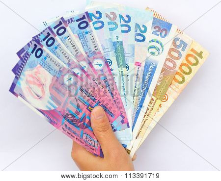 closeup of people hand with hkd cash