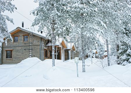 Cottages Covered With Snow In Ruka In Finland In The Arctic Pole Circle