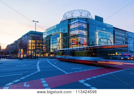 HAMBURG, GERMANY - MARCH 08: Moenckebergstrasse corner Steintorwall with Karstadt Sports at dusk on March 08, 2014 in Hamburg. The Moenckebergstrasse is the main shopping street in Hamburg.