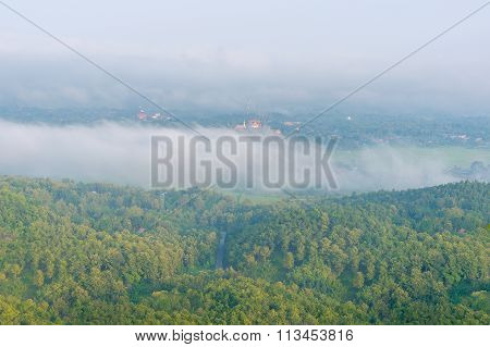 Wat Phra That Cho Hae with Fog on early morning Looking from Wat Pra That Doi Leng View Point at Phr