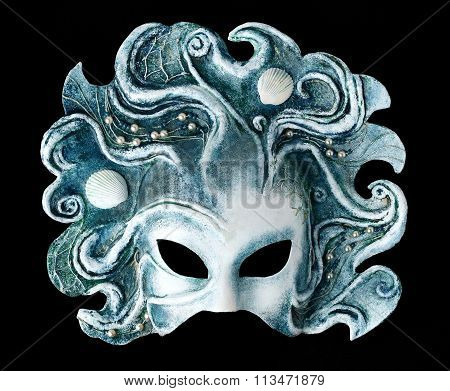 Interior and carnaval mask embodying the element of water, isolated on black background