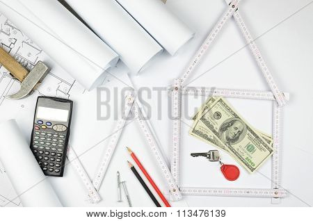 White Meter Tool Forming A House And Tools On White Paper Background