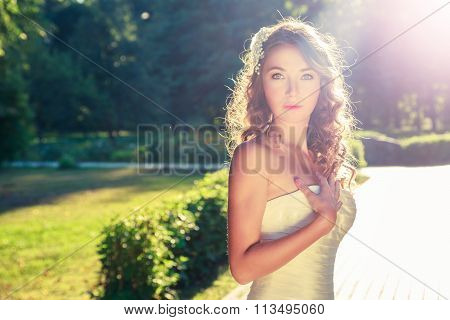Stylish Young Bride Outdoors at Nature Background.