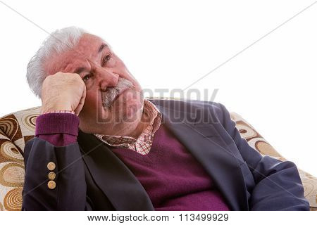 Elderly Retired Man Relaxing In A Chair