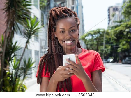 African Woman With Dreadlocks Sending Message In The City