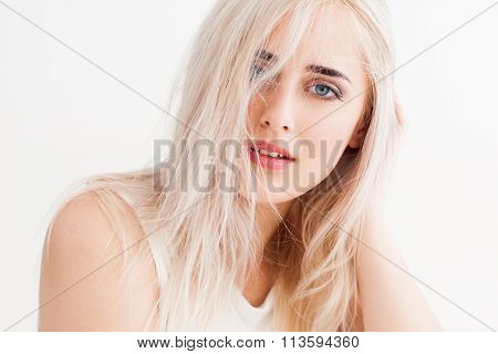 Disheveled Blonde Calmly And Trustingly Looks