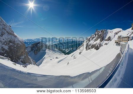 People sunbathe at the terrace of the Pilatus-Kulm luxury hotel at the top of the Pilatus mountain.