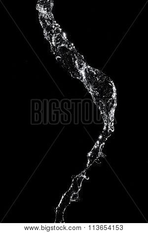 Abstract Splashes And Drops Of Water On Black Background.