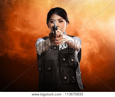 Beautiful Police Woman Holding Gun