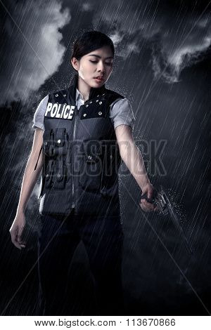 Beautiful Police Woman Holding Gun