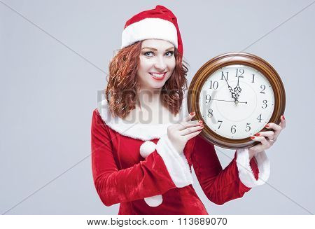 Time And Christmas Holiday Concept. Portrait Of Smiling And Gleeful Red-haired Santa Helper Showing