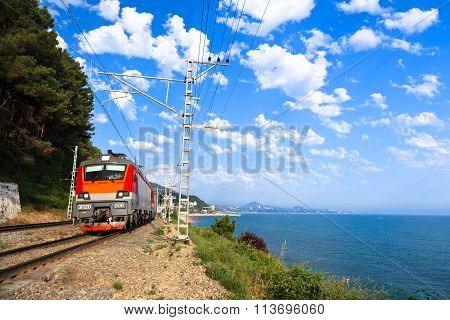 A  Red Train Goes Along The Shore