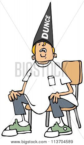 Boy wearing a dunce hat