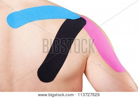 Man with kinesiotaping on the shoulder, isolated on white background