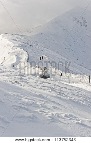 Downhill Skiers And Snowboarder On Kasprowy Wierch In Zakopane In Tatras In Winter