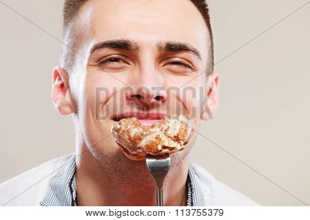 Smiling Man Eating Cake.